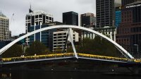 Yellow ribbons hang from the Southbank pedestrian bridge.